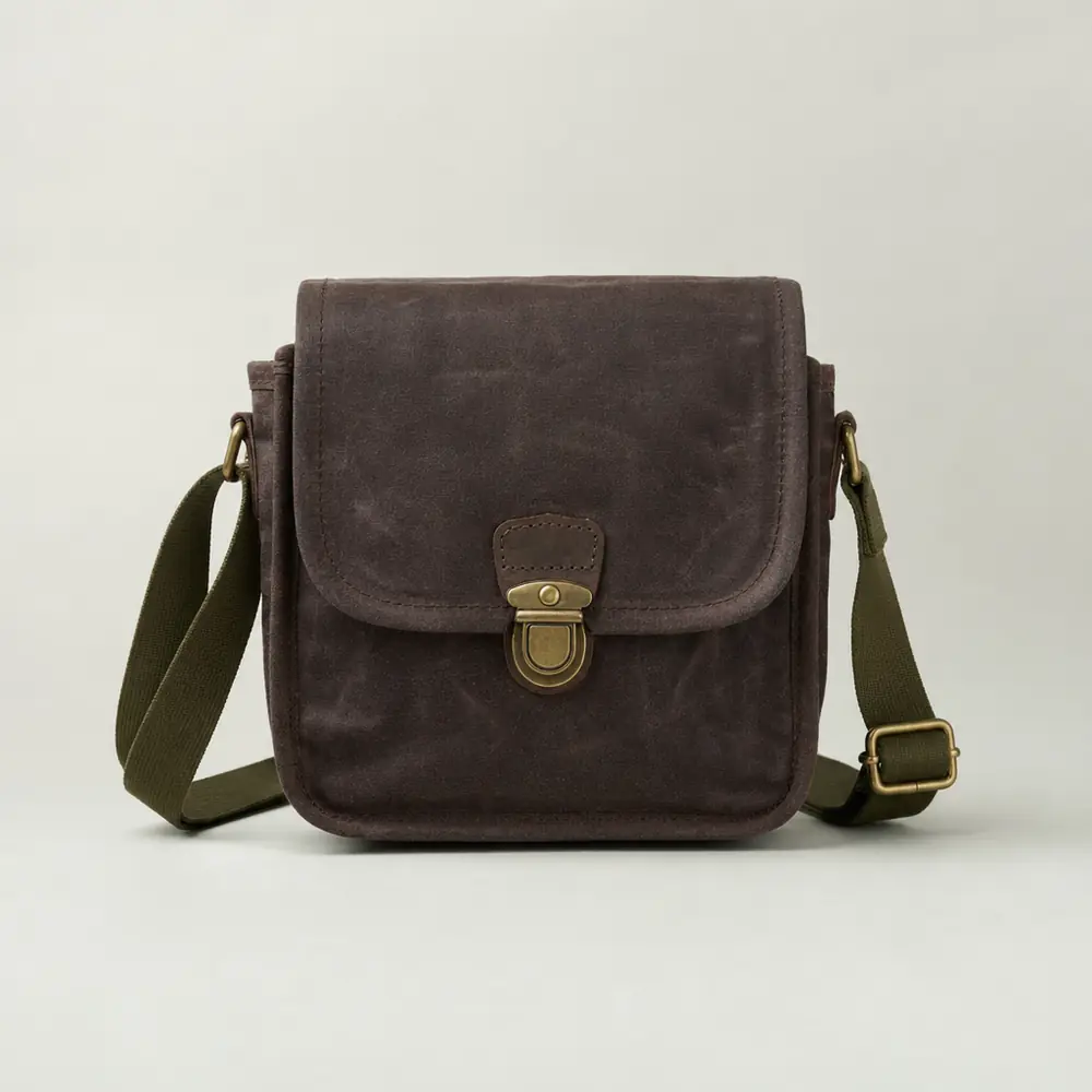 The Map Case Sling in peat waxed cotton